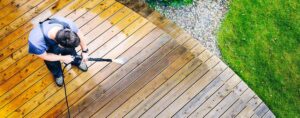 A Person Use a Pressure Washer